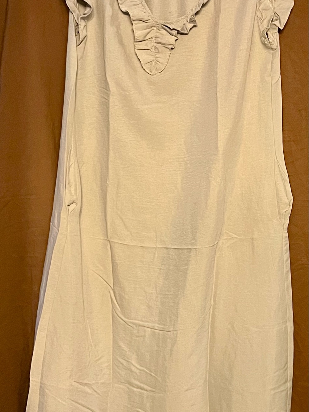 Woman’s Cream Tank Top with Ruffle V-Neck